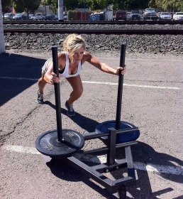 Carly pushing the 120LB Power Sled